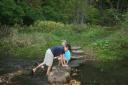 Jensen and Kent playing in the river