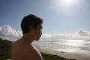 Jensen watching the surf at Newport, OR